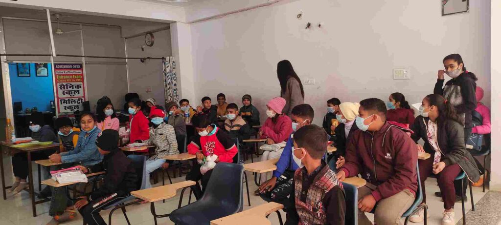 Students writing exam in classroom